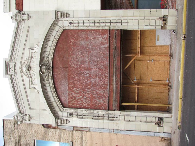 The owner of the old New Theatre on 10th Street downtown wants to restore the carriage entrance to its early 20th century glory, while renovation of the interior is on his bucket list.