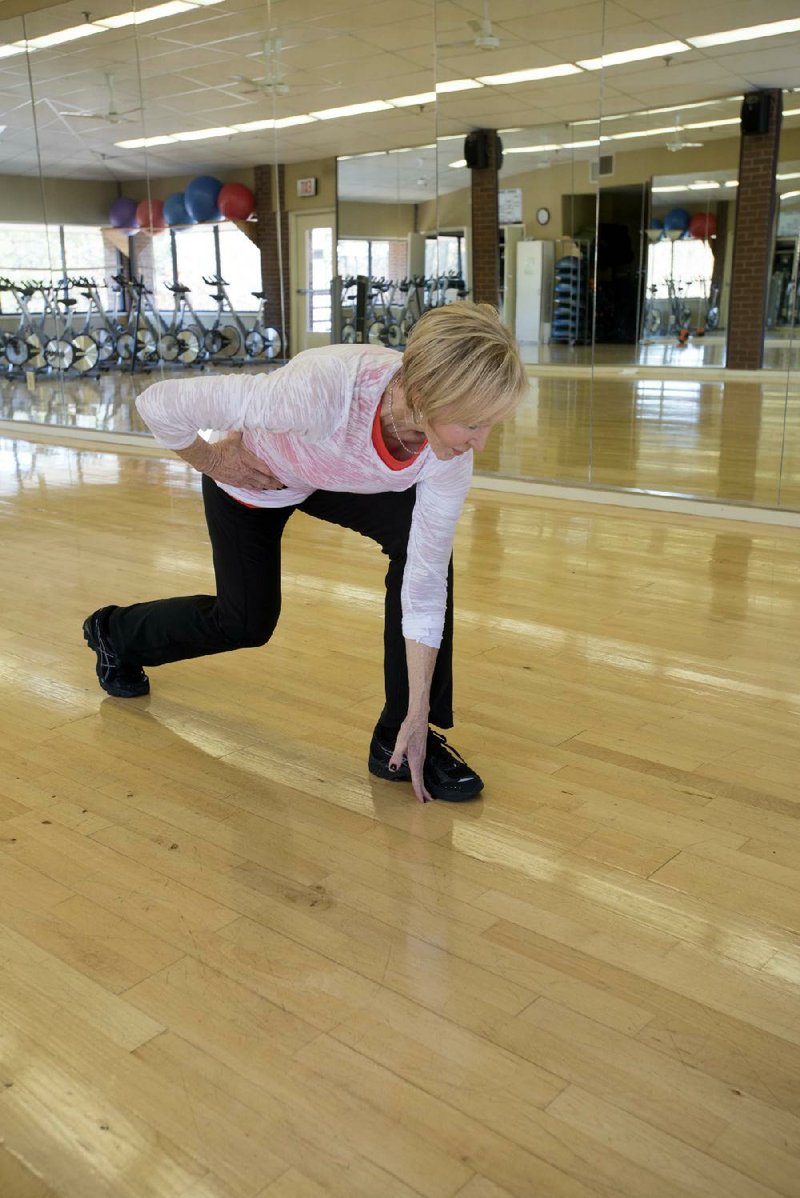 Sandra Ashcraft performs the Skater Lunge at the Little Rock Athletic Club.  For the November Fit Master Series.