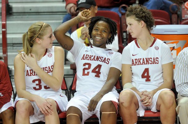 Arkansas players Melissa Wolf, Quistelle Williams and Sarah Watkins relax on the bench for the final minutes of their 80-41 win over Northwestern State on Friday, Dec. 21, at bud Walton Arena in Fayetteville.