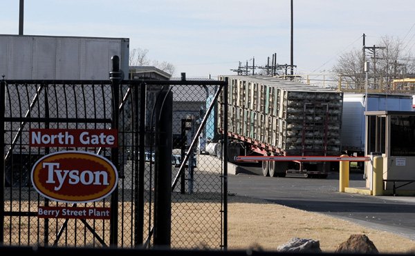 A truck drives onto scales Tuesday at the Tyson Foods Berry Street plant in Springdale. While factors such as feed costs will continue to present challenges, Tyson appears to have weathered the recession, said Worth Sparkman, company spokesman. 