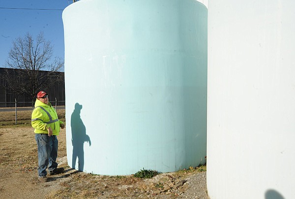Alfred DeRoche, a crew leader with Fayetteville’s Transportation Division, shows the city’s storage silo Friday for the supply of beet juice the city plans to use to treat roads for snow and ice. 