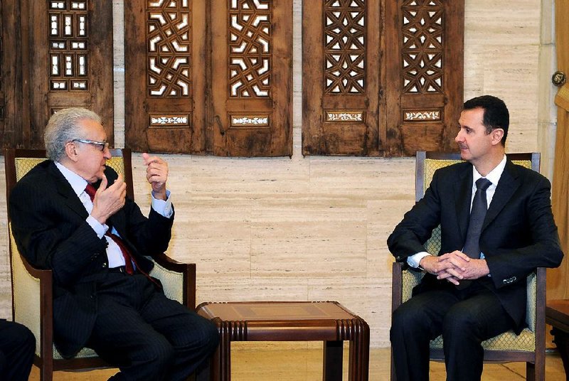 In this photo released by the Syrian official news agency SANA, Syrian President Bashar al-Assad, right, meets with UN Arab League deputy to Syria, Lakhdar Brahimi in Damascus, Syria, Monday, Dec. 24, 2012. The international envoy tasked with pushing to end Syria's civil war said the situation is still "worrying" after discussing the crisis with President Bashar Assad on Monday. The remarks gave no indication of progress toward a negotiated solution to the conflict. (AP Photo/SANA)