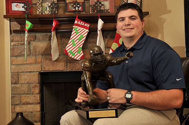 Jonathan Luigs, former University of Arkansas football player, won the Rimington Trophy as a Razorback before his NFL career.