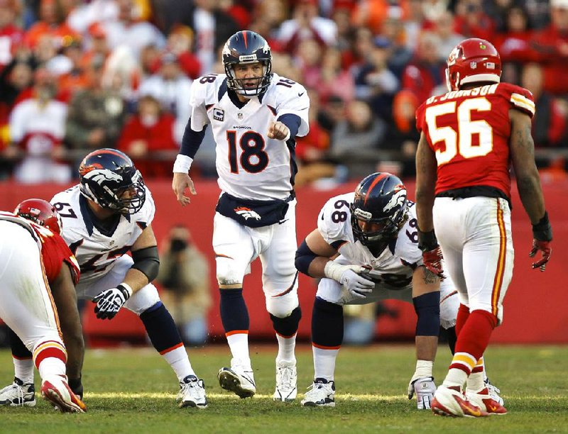Denver Broncos quarterback Peyton Manning (18) in his 14th NFL season, every game as a starter, he led the Broncos to 13 victories. He completed 68.8 percent of his passes, the second-best percentage of his career, and had a quarterback rating of 105.8, also his second best, and the best since 2004 when it was 121.1.