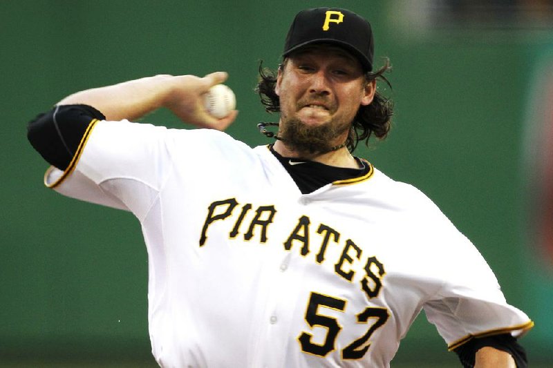 In this July 7, 2012, photo, Pittsburgh Pirates closer Joel Hanrahan delivers during the ninth inning of a baseball game against the San Francisco Giants in Pittsburgh. A person familiar with the talks says the Pirates and the Boston Red Sox are close to completing a trade that would send Hanrahan to Boston for a handful of prospects. Pittsburgh would ship Hanrahan and another player to the Red Sox in exchange for four players, (AP Photo/Gene J. Puskar)