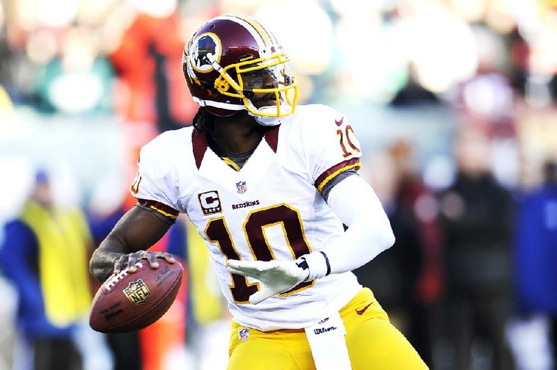 Washington Redskins' Robert Griffin III in action in the second half of an NFL football game against the Philadelphia Eagles, Sunday, Dec. 23, 2012, in Philadelphia. (AP Photo/Michael Perez)