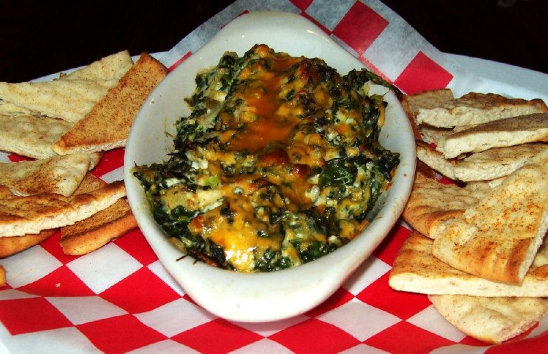 An order of Spinach Artichoke Dip at Brick Oven Pizza in Cabot, is served with toasted pita bread for dipping.