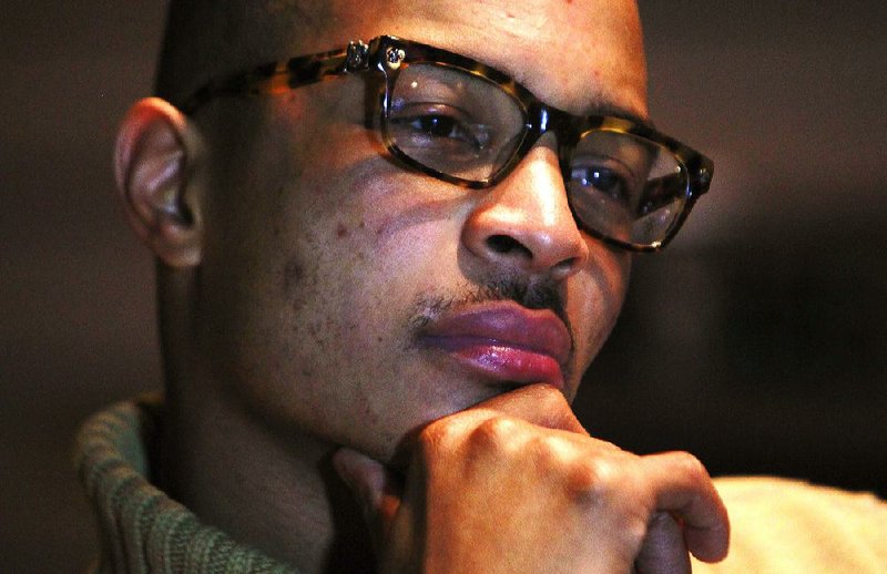 In this Oct. 12, 2011 photo, rapper T.I. speaks during an interview in Atlanta. After serving 10 months in federal prison on a probation violation, the so-called ìKing of the Southî is trying to regain momentum in a career slowed by his incarceration, and at the same time, show people he can have a positive influence on the youth despite his well-documented troubles.   (AP Photo/John Bazemore) 