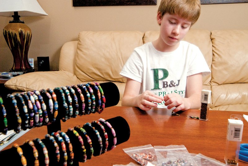 Rachel Frank, 10, made the second round of the Young Entrepreneur Showcase (Y.E.S.) with her business plan to make paper-bead bracelets. She makes them from the colorful ads in magazines.