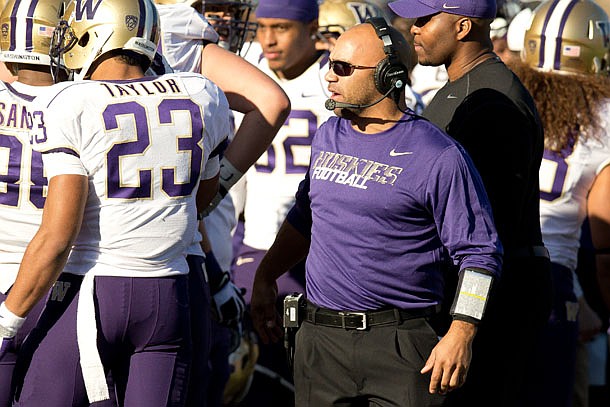 Joel Thomas, pictured during a Washington-Boise State game, was hired by the Razorbacks on Monday and has helped Terrell Newby's interest toward the Razorbacks.