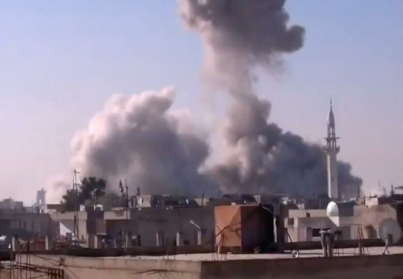 Smoke rises during heavy shelling Thursday in Homs, Syria, in an image taken from video obtained from the Shaam News Network. 