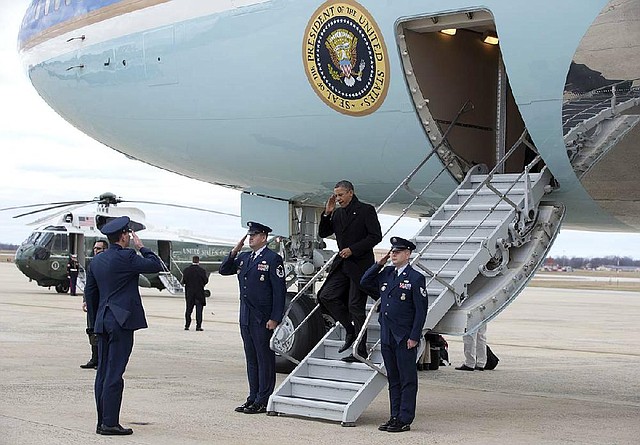 President Barack Obama arrives Thursday at Andrews Air Force Base in Maryland. He is to meet today with congressional leaders regarding the “fiscal cliff.” 