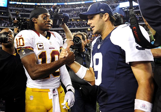 The Washington Redskins, led by quarterback Robert Griffin III (left), meet Tony Romo and the Dallas Cowboys on Sunday night in a game that will decide the NFC East. 