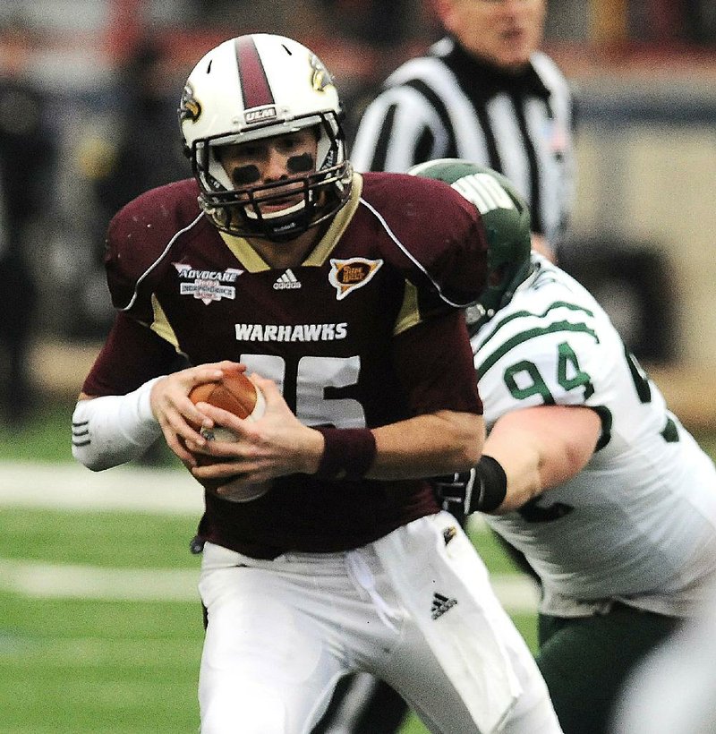 Louisiana-Monroe quarterback Kolton Browning is hit for a loss by Ohio’s Corey Hasting in the first quarter of a 45-14 loss to Ohio in the Independence Bowl in Shreveport. 