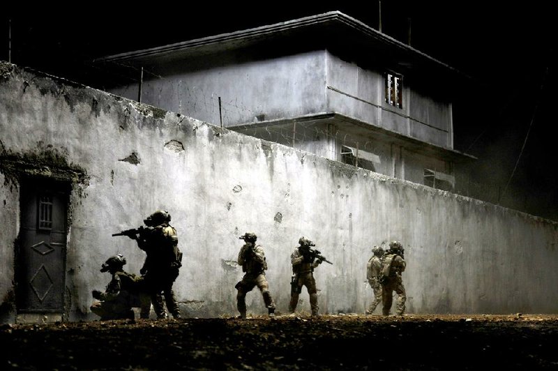 Soldiers approach the compound of Osama bin Laden in Zero Dark Thirty. 