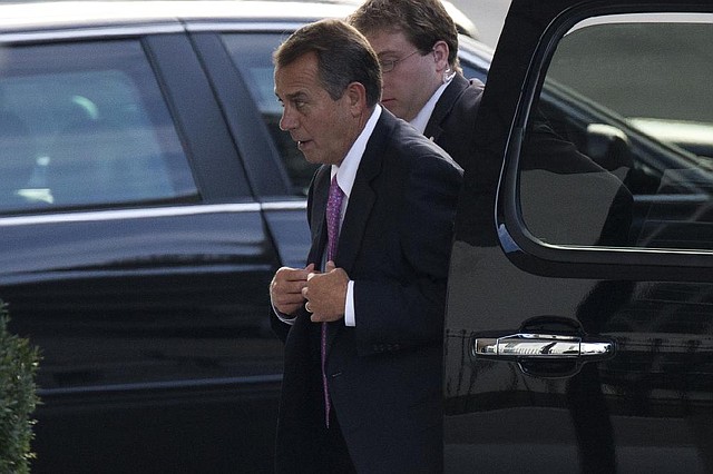 House Speaker John Boehner arrives Friday at the White House for a meeting between President Barack Obama and congressional leaders to negotiate an agreement regarding the “ÿscal cliff.” 