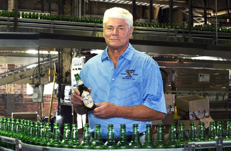 Richard L. “Dick” Yuengling Jr., owner of D.G. Yuengling & Son Inc., holds a bottle of beer earlier this month at his brewery in Pottsville, Pa. 