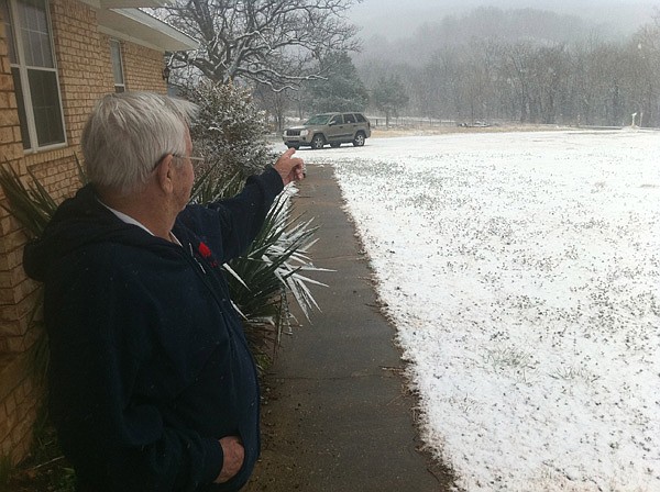 Richard Haegele, one of the three people who found Ronnie Lee Bradley’s body, points to the crime scene, which was next door to his home. Haegele’s daughter-in-law, Paula, found the body while doing morning chores Thursday and ran to Haegele’s home to call 911. 