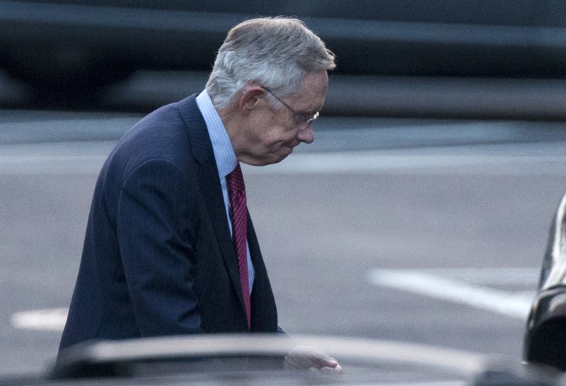 Senate Majority Leader Harry Reid of Nev. leaves the White House in Washington, Friday, Dec. 28, 2012, after a closed-door meeting between President Barack Obama and Congressional leaders to negotiate the framework for a deal on the fiscal cliff. The end game at hand, President Barack Obama and congressional leaders made a final stab at compromise Friday to prevent a toxic blend of middle-class tax increases and spending cuts from taking effect at the turn of the new year.