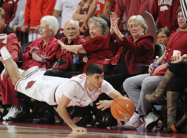 Kikko Haydar, an Arkansas junior, fights to keep a ball inbounds against Florida A&M in the first half Nov. 20 at Bud Walton Arena in Fayetteville. 