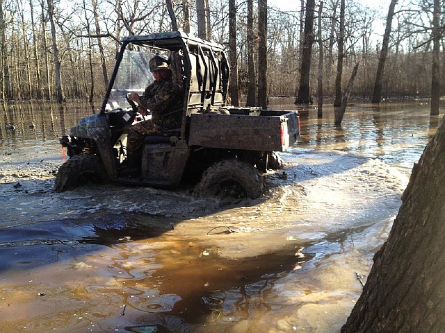 Getting to Bruce Sharp’s duck blind requires a wet ride through flooded timber. 