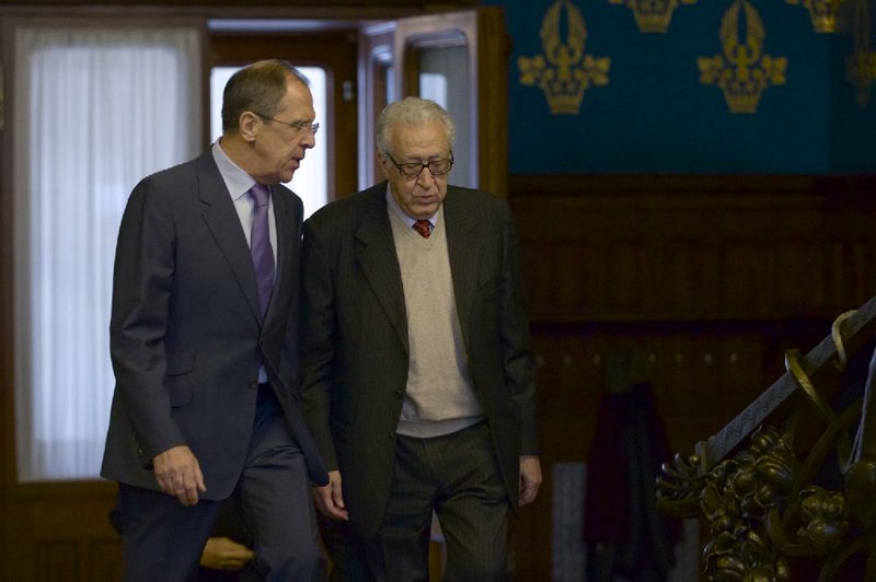 Russian Foreign Minister Sergey Lavrov (left) meets Saturday in Moscow with U.N. envoy Lakhdar Brahimi, who warned of the danger of “panic in Damascus.” 