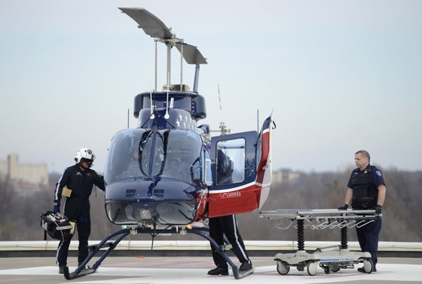 An air evacuation crew arrives Thursday at Mercy Hospital Springfield with a vehicle-accident victim from Cherokee City in Benton County, Ark.
