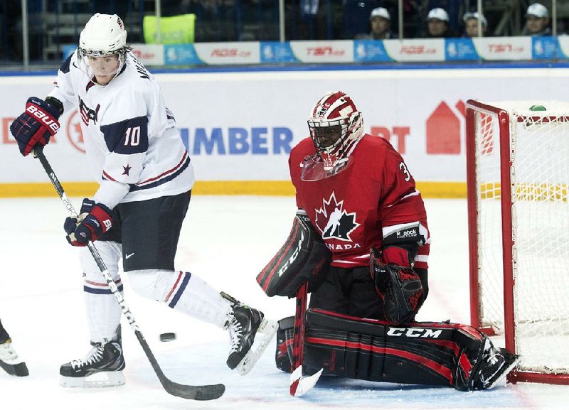Team Canada goalie Malcolm Subban (right) makes a pad save on Team USA forward J.T. Miller (10) during the third period of Canada’s 2-1 victory Sunday in the junior ice hockey world championships. 