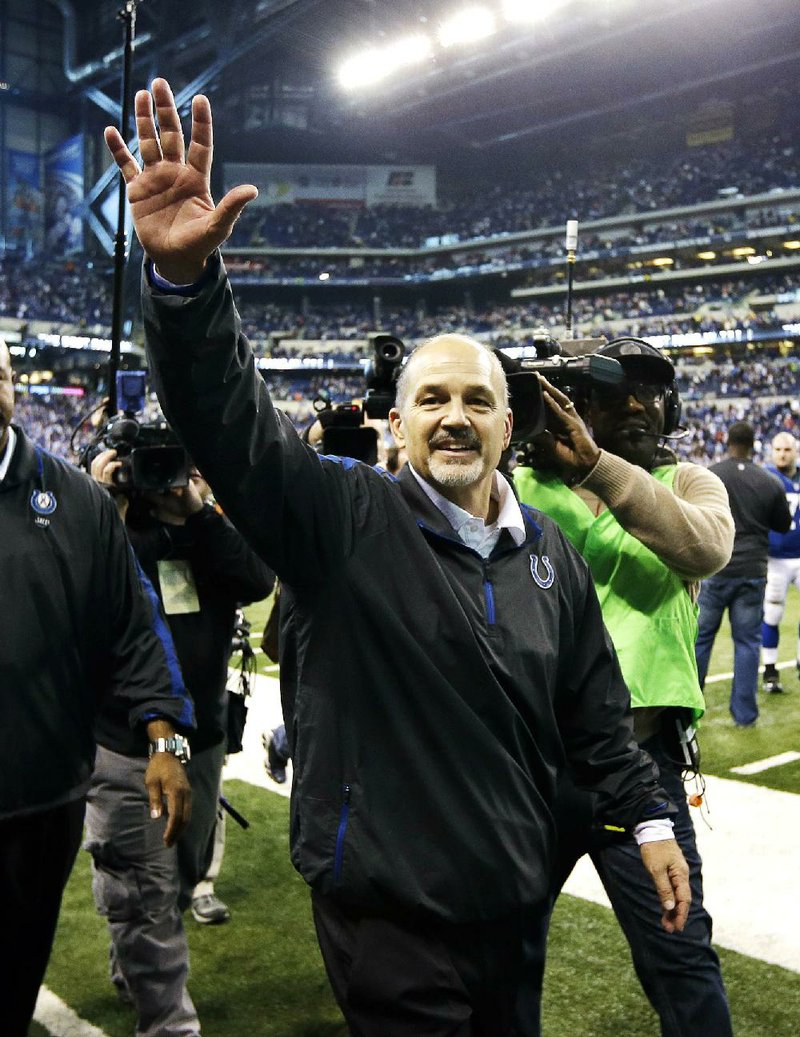 Coach Chuck Pagano waves to the crowd at Lucas Oil Stadium in Indianapolis on Sunday afternoon after the Colts beat the Houston Texans 28-16. Pagano took an indefinite leave of absence Sept. 26 to begin the first of three rounds of chemotherapy for leukemia and didn’t make it back to the sideline until Sunday when the cancer was in complete remission. 