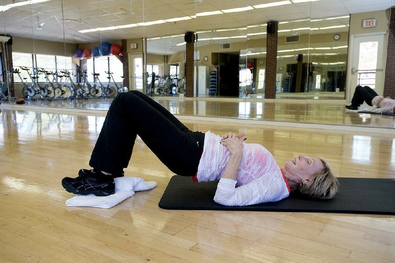 Sandra Ashcraft does two versions of the Sliding Leg Curl; raising the hips is a more advanced exercise, but both will challenge the hamstrings. 