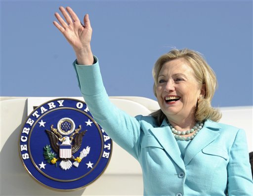 In this June 10, 2011 file photo, Secretary of State Hillary Rodham Clinton waves as the arrives at Lusaka International Airport in Lusaka, Zambia. Clinton has been admitted to a New York hospital after the discovery of a blood clot stemming from the concussion she sustained earlier this month. Spokesman Philippe Reines says her doctors discovered the clot during a follow-up exam Sunday.