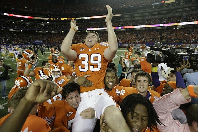 Clemson place-kicker Chandler Catanzaro (center) is hoisted into the air after he made a 37-yard game-winning field goal to beat LSU 25-24 on Monday night in the Chick-fil-A Bowl at the Georgia Dome in Atlanta. 