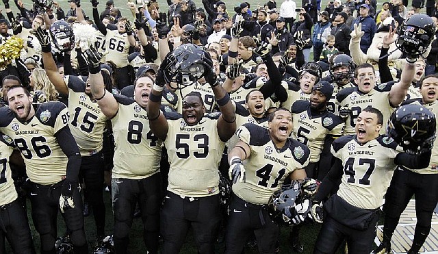 Vanderbilt players celebrate Monday afternoon after beating North Carolina State 38-24 in the Music City Bowl at LP Field in Nashville, Tenn. The Commodores intercepted Wolfpack quarterback Mike Glennon three times and forced two fumbles. 