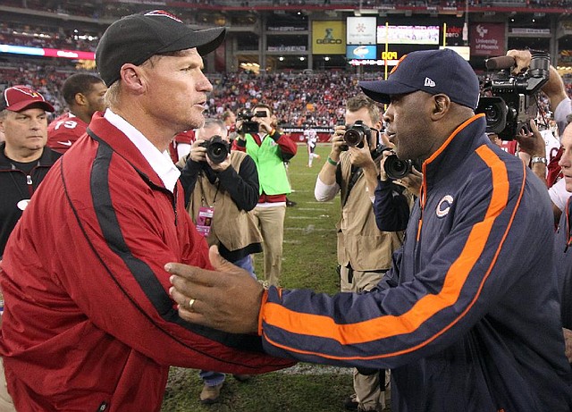 Coaches Ken Whisenhunt (left) and Lovie Smith were fired by the Arizona Cardinals and Chicago Bears, respectively. Whisenhunt and Smith were two of seven NFL coaches to be fired Monday. 