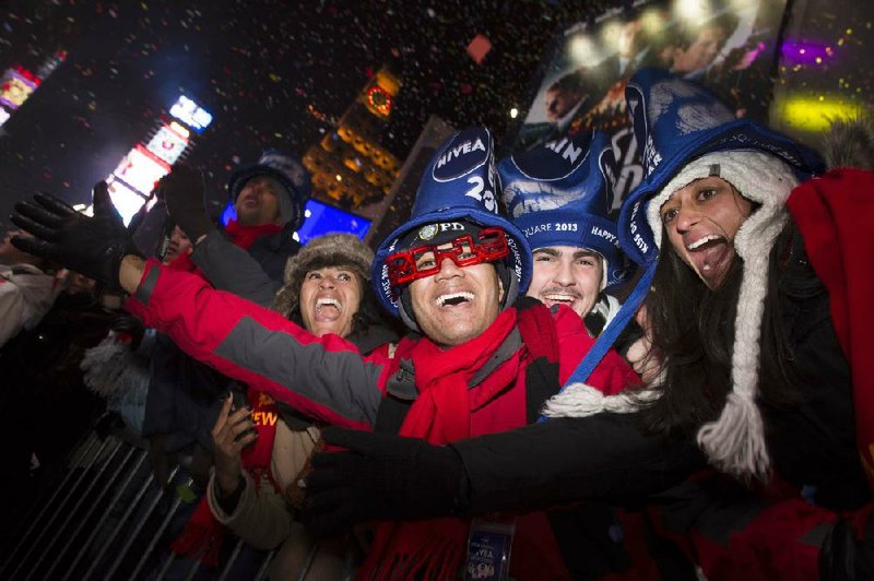 Revelers cheer at midnight in Times Square in New York. 