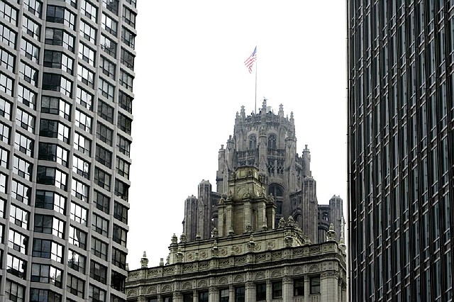The Chicago Tribune Building is seen between two skyscrapers in downtown Chicago. The company’s started distributions to creditors after a four-year bankruptcy 
