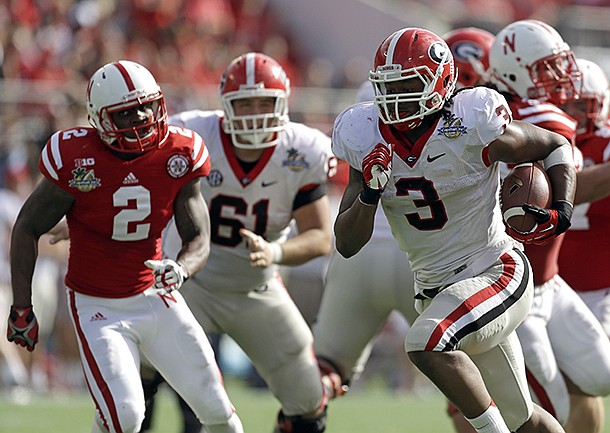 Georgia running back Todd Gurley (3) runs for a 24-yard touchdown past the Nebraska defense during the first half of the Capital One Bowl NCAA football game, Tuesday, Jan. 1, 2013, in Orlando, Fla. (AP Photo/John Raoux)