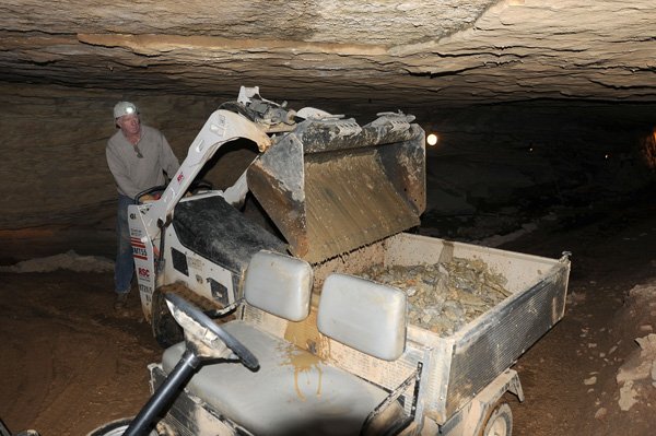 Steve Turner, a commercial cave expert from Tennessee, removes loose rock from War Eagle Cavern on Nov. 27 during construction of a tunnel that will allow more visitor access to the cavern. 
