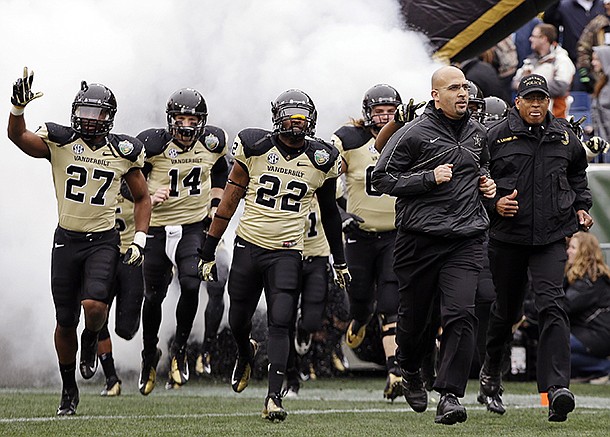 Vanderbilt head coach James Franklin, second from right, leads his team onto the field for the Music City Bowl NCAA college football game against North Carolina State, Monday, Dec. 31, 2012, in Nashville, Tenn. (AP Photo/Mark Humphrey)