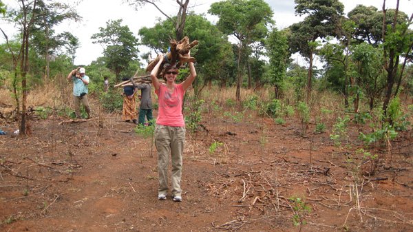 Sara Steinlage carries firewood as part of her chores at the Go Women Go Community group in Mpomgwe, Zambia, on Nov. 3. Steinlage took a 12-day trip that showcased Heifer International projects in Kenya and Zambia. 