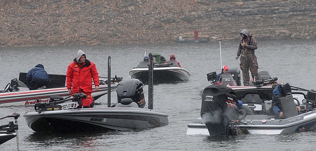 Bundled up anglers wait to take their boats out of the water on New Year's Day during the annual Polar Bear bass tournament at Beaver Lake. 