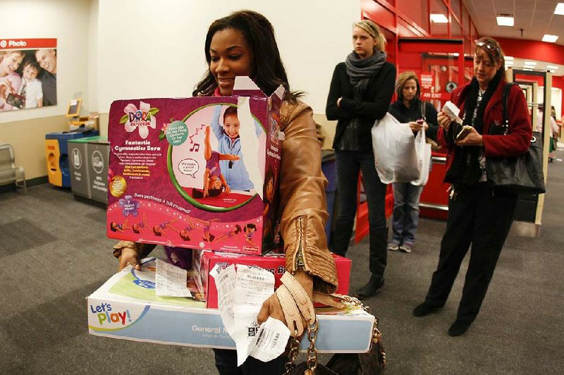 Sheathia Lee returns gifts for her two children while at a Target store in Chattanooga, Tenn. 