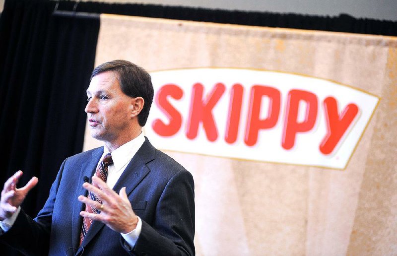 Hormel Foods CEO Jeff Ettinger holds a news conference Thursday at Hormel Corporate North in Austin, Minn. Hormel Foods is buying Skippy, the country’s No. 2 peanut butter brand, for about $700 million. 