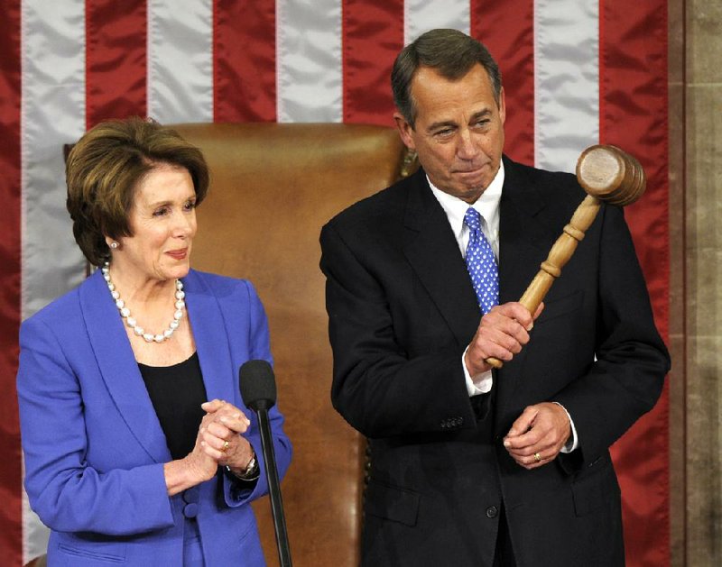 House Minority Leader Nancy Pelosi applauds Thursday after handing the gavel to John Boehner, who was re-elected as House speaker of the 113th Congress. Boehner said, “The American dream is in peril so long as its namesake is weighed down by this anchor of debt.”

