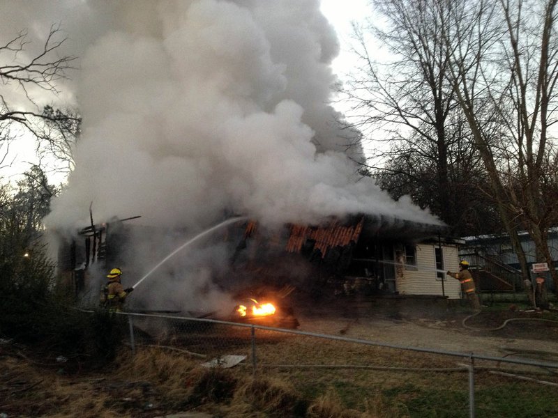 Firefighting crews respond to a home blaze Jan. 4, 2013, outside North Little Rock.
