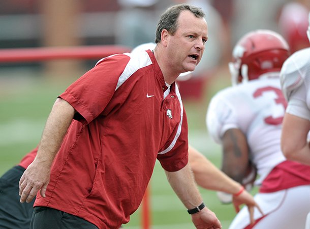 Tim Horton works with Arkansas' running backs during an April 2012 practice at Donald W. Reynolds Razorback Stadium. 