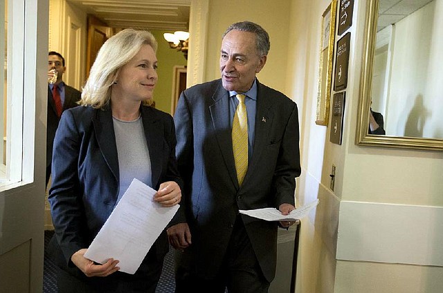 New York’s Democratic Sens. Charles Schumer and Kirsten Gillibrand enter a news conference Friday on Capitol Hill in Washington to discuss superstorm Sandy aid. An aid bill passed both houses of Congress on Friday. 