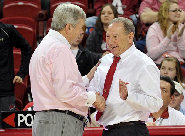 “It’s a grind in the SEC,” Arkansas women’s Coach Tom Collen (right, shown with Texas A&M Coach Gary Blair) said Monday at the Downtown Tip-Off Club.