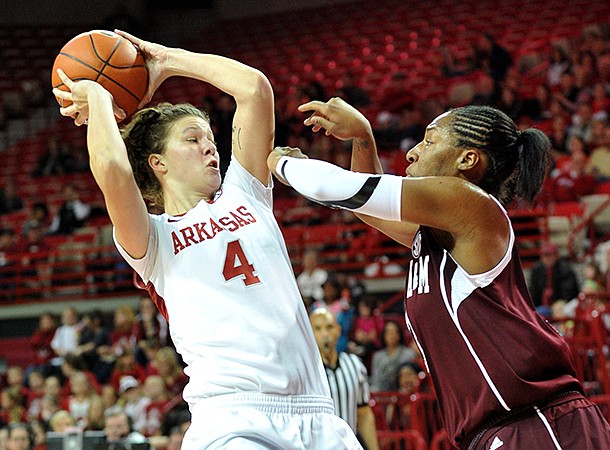 NWA Media/MICHAEL WOODS --01/06/2013-- Arkansas forward Sarah Watkins tries to get past Texas A&M defender Cierra Windham during Sunday afternoon's game at Bud Walton Arena in Fayetteville.
