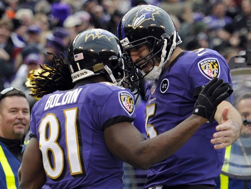 Baltimore Ravens wide receiver Anquan Boldin (81) celebrates his touchdown catch with quarterback Joe Flacco (5) during the second half of an NFL wild card playoff football game against the Indianapolis Colts Sunday, Jan. 6, 2013, in Baltimore.